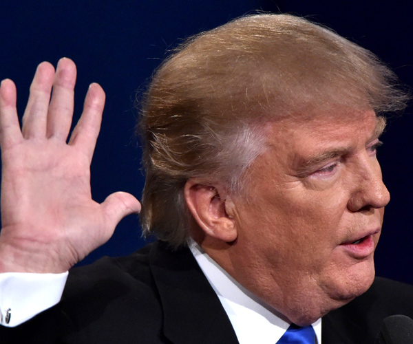 Republican nominee Donald Trump gestures during the first presidential debate at Hofstra University in Hempstead, New York on September 26, 2016. / AFP / Paul J. Richards        (Photo credit should read PAUL J. RICHARDS/AFP/Getty Images)